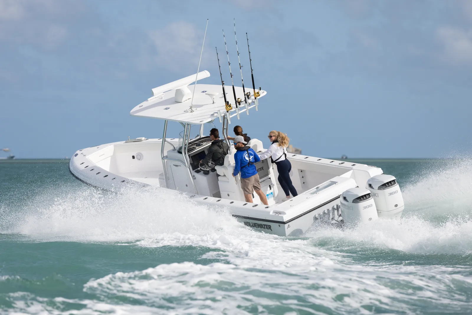 Bluewater 2850 running fast with four anglers in the cockpit